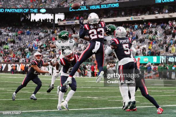 New England Patriots players knock the ball away in the end zone on the final play of a game to beat New York Jets 15-10 at MetLife Stadium on...