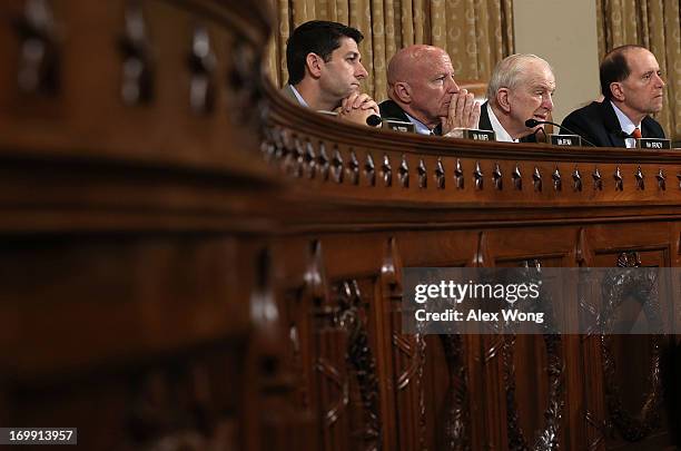 Rep. Paul Ryan , Rep. Kevin Brady , Rep. Sam Johnson , committee chairman Rep. Dave Camp listen during a hearing before the House Ways and Means...