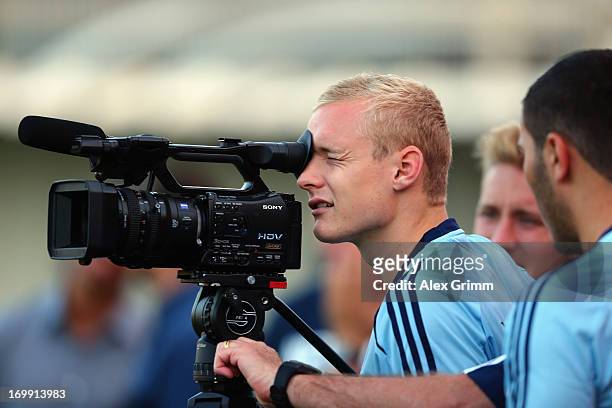 Sebastian Rode looks through a TV camera during a Germany U21 training session at Hodorov training ground on June 4, 2013 in Tel Aviv, Israel.