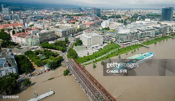 This picture taken from a helicopter on June 4, 2013 shows Bratislava's harbor and shoping center at overflowing Danube river. Torrential rain and...