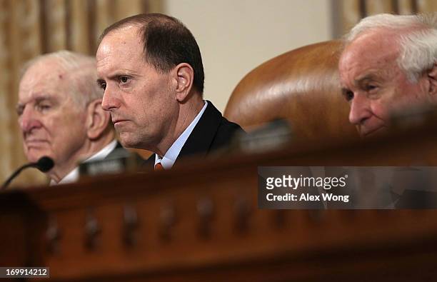 Committee Chairman Rep. Dave Camp , ranking member Rep. Sander Levin and Rep. Sam Johnson listen during a hearing before the House Ways and Means...