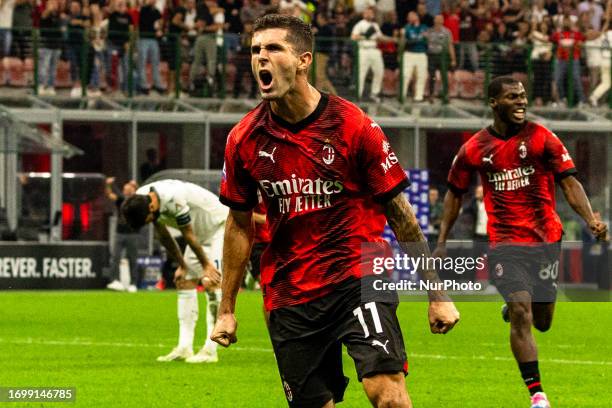 Christian Pulisic celebrates after scoring a goal during the Serie A football match between AC Milan and SS Lazio at Giuseppe Meazza Stadium in San...