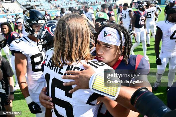 Trevor Lawrence of the Jacksonville Jaguars and C.J. Stroud of the Houston Texans embrace after the game at EverBank Stadium on September 24, 2023 in...