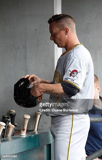 Brandon Inge of the Pittsburgh Pirates puts away his helmet after striking out during an interleague baseball game against the Detroit Tigers at...