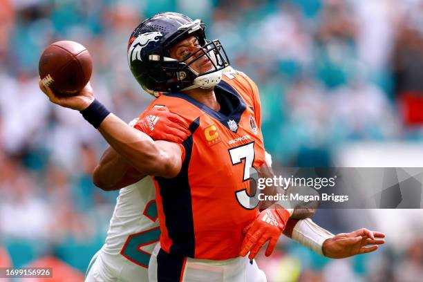 Justin Bethel of the Miami Dolphins sacks Russell Wilson of the Denver Broncos during the third quarter at Hard Rock Stadium on September 24, 2023 in...