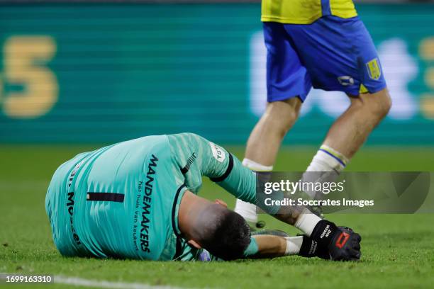Keeper Etienne Vaessen of RKC Waalwijk lies injured on the ground after his crash with Brian Brobbey of Ajax during the Dutch Eredivisie match...