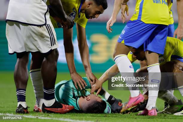 Yassin Oukili of RKC Waalwijk Shawn Adewoye of RKC Waalwijk checking on keeper Etienne Vaessen of RKC Waalwijk who is heavy injured after his crash...