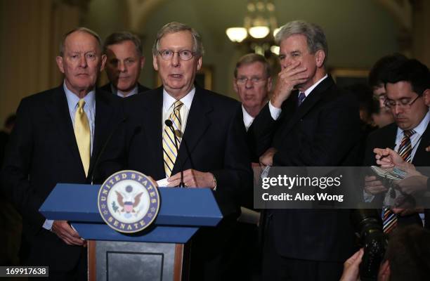 Senate Minority Leader Sen. Mitch McConnell speaks to members of the media as Sen. Lamar Alexander , Sen. Richard Burr , Sen. Johnny Isakson , and...