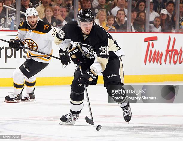 Jussi Jokinen of the Pittsburgh Penguins moves the puck against the Boston Bruins in Game One of the Eastern Conference Final during the 2013 NHL...