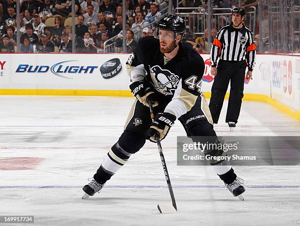 Brooks Orpik of the Pittsburgh Penguins moves the puck against the Boston Bruins in Game One of the Eastern Conference Final during the 2013 NHL...