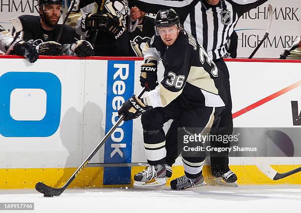 Jussi Jokinen of the Pittsburgh Penguins moves the puck against the Boston Bruins in Game One of the Eastern Conference Final during the 2013 NHL...