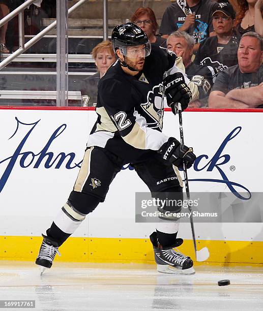 Jarome Iginla of the Pittsburgh Penguins moves the puck against the Boston Bruins in Game One of the Eastern Conference Final during the 2013 NHL...