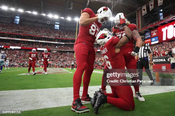 James Conner of the Arizona Cardinals celebrates a rushing touchdown during the first quarter of a game against the Dallas Cowboys at State Farm...