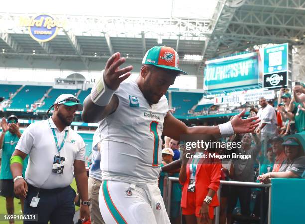 Tua Tagovailoa of the Miami Dolphins reacts after his team's 70-20 win against the Denver Broncos at Hard Rock Stadium on September 24, 2023 in Miami...