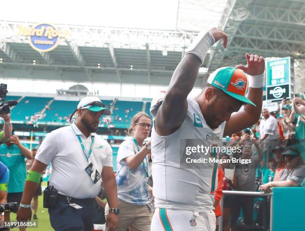 Tua Tagovailoa of the Miami Dolphins reacts after his team's 70-20 win against the Denver Broncos at Hard Rock Stadium on September 24, 2023 in Miami...