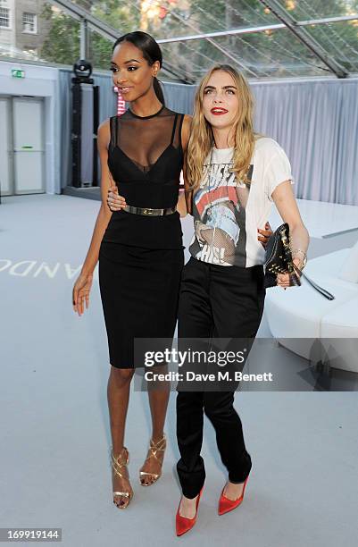 Jourdan Dunn and Cara Delevingne arrive at the Glamour Women of the Year Awards in association with Pandora at Berkeley Square Gardens on June 4,...