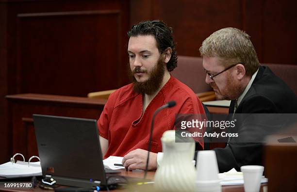 James Holmes reviews advisement paperwork with his attorney, Daniel King during an hearing Tuesday morning June 04, 2013 at the Arapahoe County...