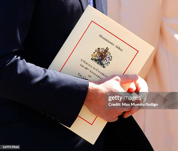 Prince William, Duke of Cambridge holds an order of service as he attends a service of celebration to mark the 60th anniversary of the Coronation of...