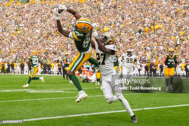 Romeo Doubs of the Green Bay Packers catches a pass for a touchdown during the second half of an NFL football game against the New Orleans Saints at...