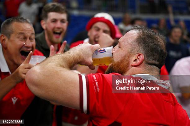 Henry Thomas of Wales celebrates with members of the crowd at full-time following the Rugby World Cup France 2023 match between Wales and Australia...