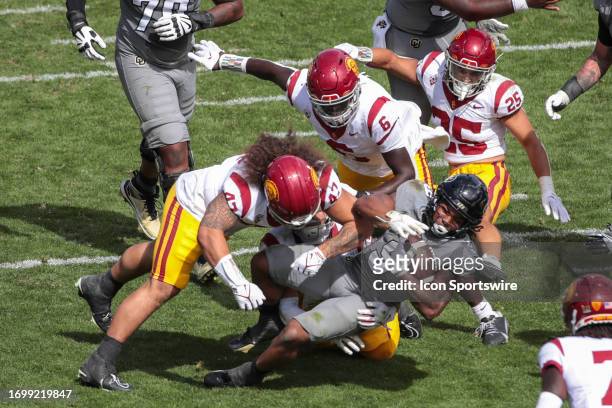 Colorado Buffaloes running back Anthony Hankerson gets tackles by USC Trojans defense during a college football game between the USC Trojans and the...