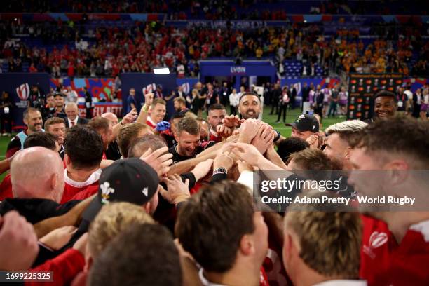 The players and staff members of Wales celebrate victory at full-time following the Rugby World Cup France 2023 match between Wales and Australia at...