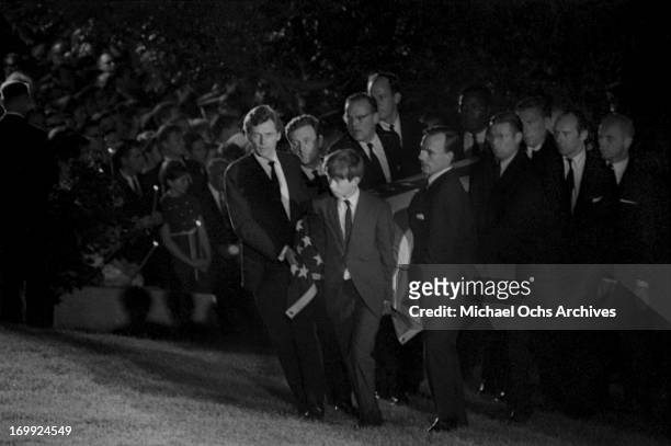 Pallbearers carry the coffin of Senator Robert Kennedy to the grave site at Arlington National Cemetery on June 9, 1968 in Arlington County, Virginia.