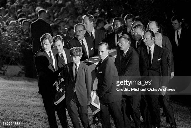 Pallbearers carry the coffin of Senator Robert Kennedy to the grave site at Arlington National Cemetery on June 9, 1968 in Arlington County, Virginia.