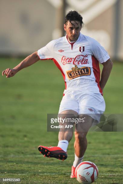 Peru's national football player Claudio Pizarro kicks the ball during a training session in Lima on June 4, 2013. Peru will play against Ecuador in...