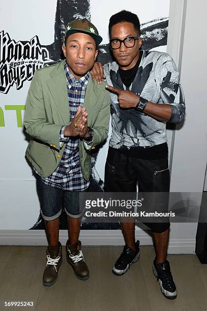 Pharrell Williams and Q-Tip attend the 10th anniversary party of Billionaire Boys Club presented by HTC at Tribeca Canvas on June 4, 2013 in New York...