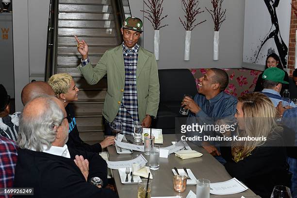 Pharrell Williams speaks to guests including Jay-Z and Beyonce at the 10th anniversary party of Billionaire Boys Club presented by HTC at Tribeca...
