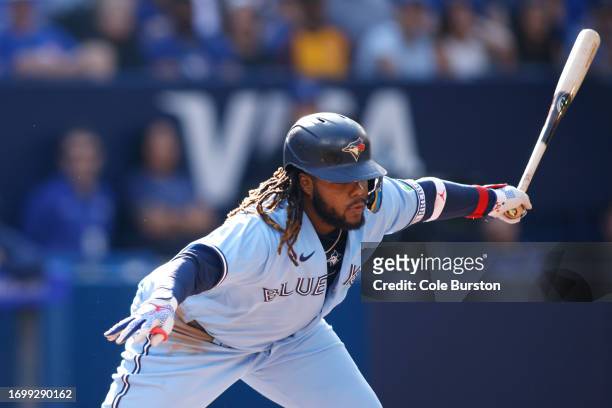 Vladimir Guerrero Jr. #27 of the Toronto Blue Jays chases a pitch for a strike in the third inning of their MLB game against the Tampa Bay Rays at...