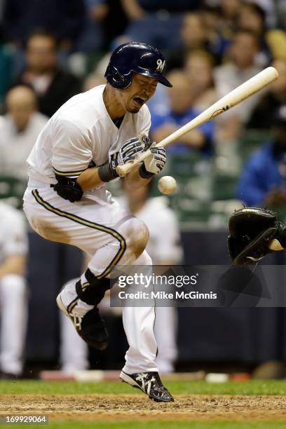 Norichika Aoki of the Milwaukee Brewers gets hit by a pitch in the bottom of the ninth inning against the Oakland Athletics during the interleague...