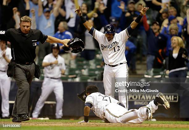 Carlos Gomez of the Milwaukee Brewers reaches home on a hit by Yuniesky Betancourt in the bottom of the tenth inning putting the Brewers on top 4-3...