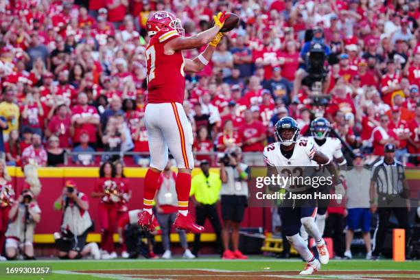 Travis Kelce of the Kansas City Chiefs catches a third quarter touchdown pass during a game against the Chicago Bears at GEHA Field at Arrowhead...