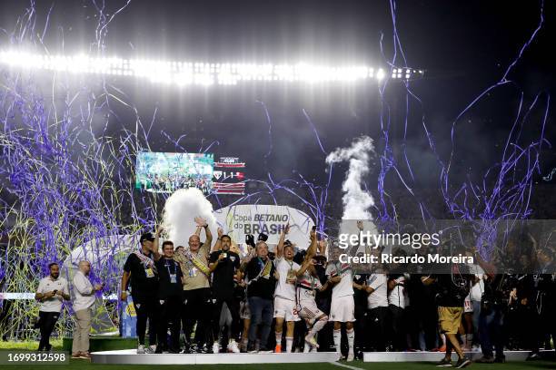 Rafinha of Sao Paulo lifts the champions trophy after winning the second leg of Copa Do Brasil 2023 final between Sao Paulo and Flamengo at Morumbi...