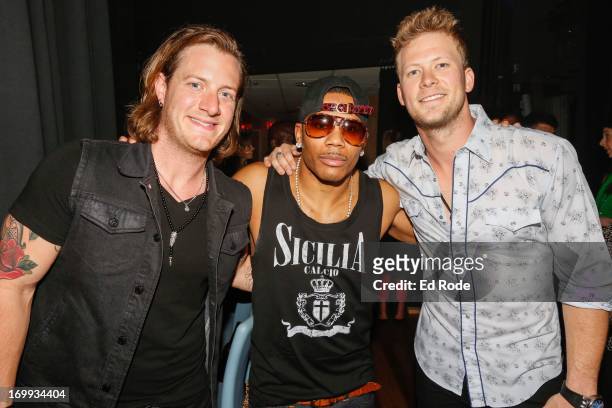 Florida Georgia Line duo Tyler Hubbard, Nelly and Brian Kelley attends the 9th annual Stars for Second Harvest Benefit at the Ryman Auditorium on...