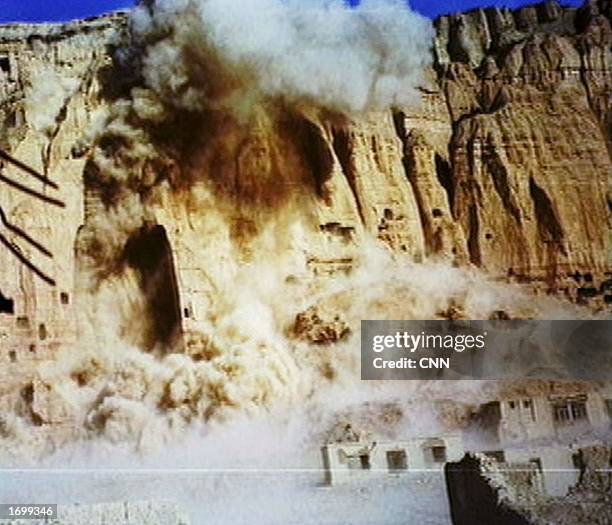 Two giant Buddhas carved into a cliff are destroyed by the Taleban at Bamiyan, Afghanistan March 12 2002, as they were deemed to be offensive to...