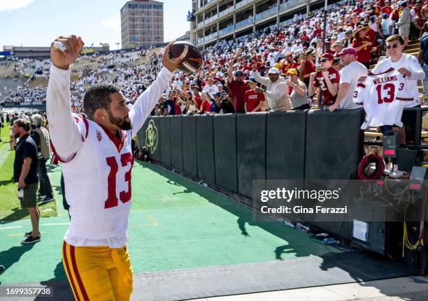 Trojans quarterback Caleb Williams reacts to the crowd as he leaves the field after beating Colorado 48-41 at Folsom Field at the University of...