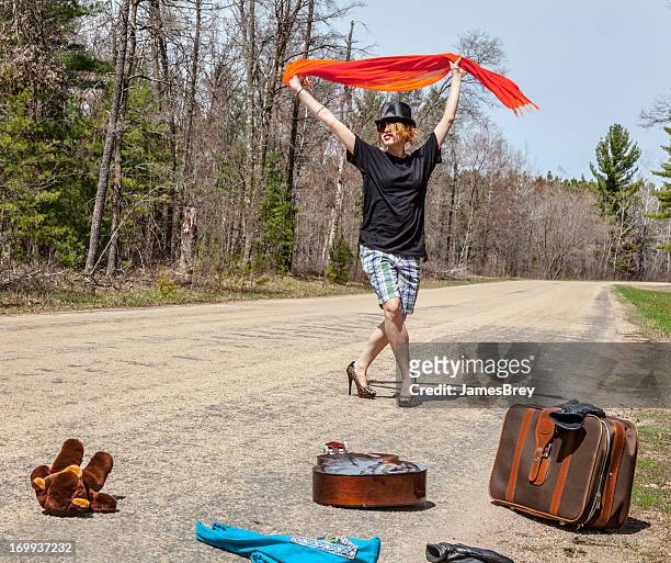 attention seeking hitchhiker girl flags-down a ride - car remote toy stock pictures, royalty-free photos & images