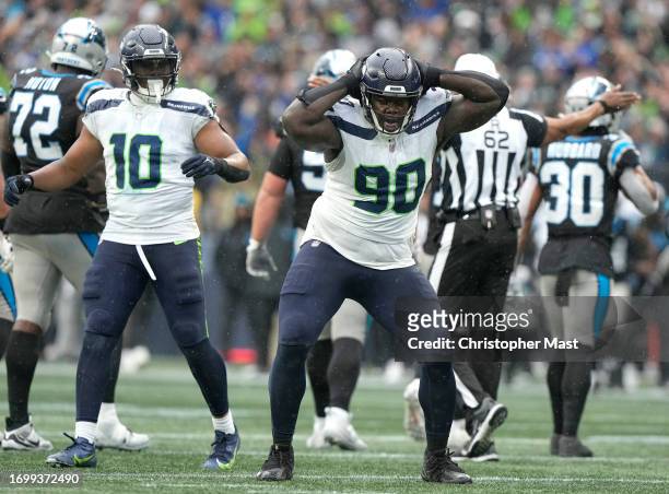 Jarran Reed of the Seattle Seahawks celebrates after a sack during the fourth quarter against the Carolina Panthers at Lumen Field on September 24,...