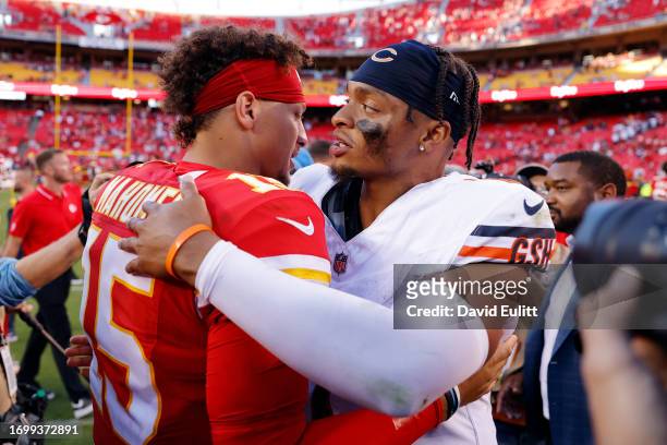 Patrick Mahomes of the Kansas City Chiefs meets Justin Fields of the Chicago Bears meet at midfield after a game at GEHA Field at Arrowhead Stadium...