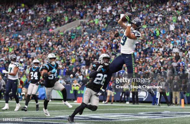 Jake Bobo of the Seattle Seahawks catches a touchdown over Donte Jackson of the Carolina Panthers during the fourth quarter at Lumen Field on...