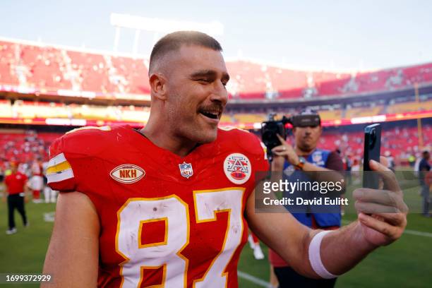 Travis Kelce of the Kansas City Chiefs talks on his phone after a game against the Chicago Bears at GEHA Field at Arrowhead Stadium on September 24,...
