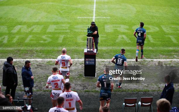 James Roby of St.Helens and Stefan Ratchford of Warrington lead their sides out prior to the Betfred Super League Play-Off match between St Helens...