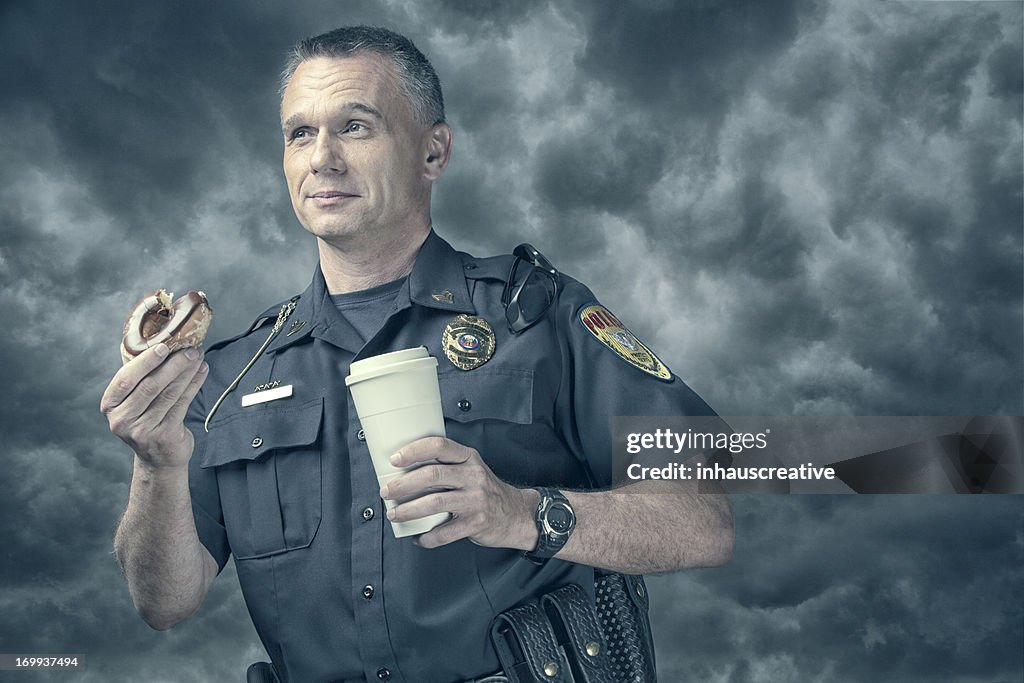 Policeman excited about his donut and coffee break