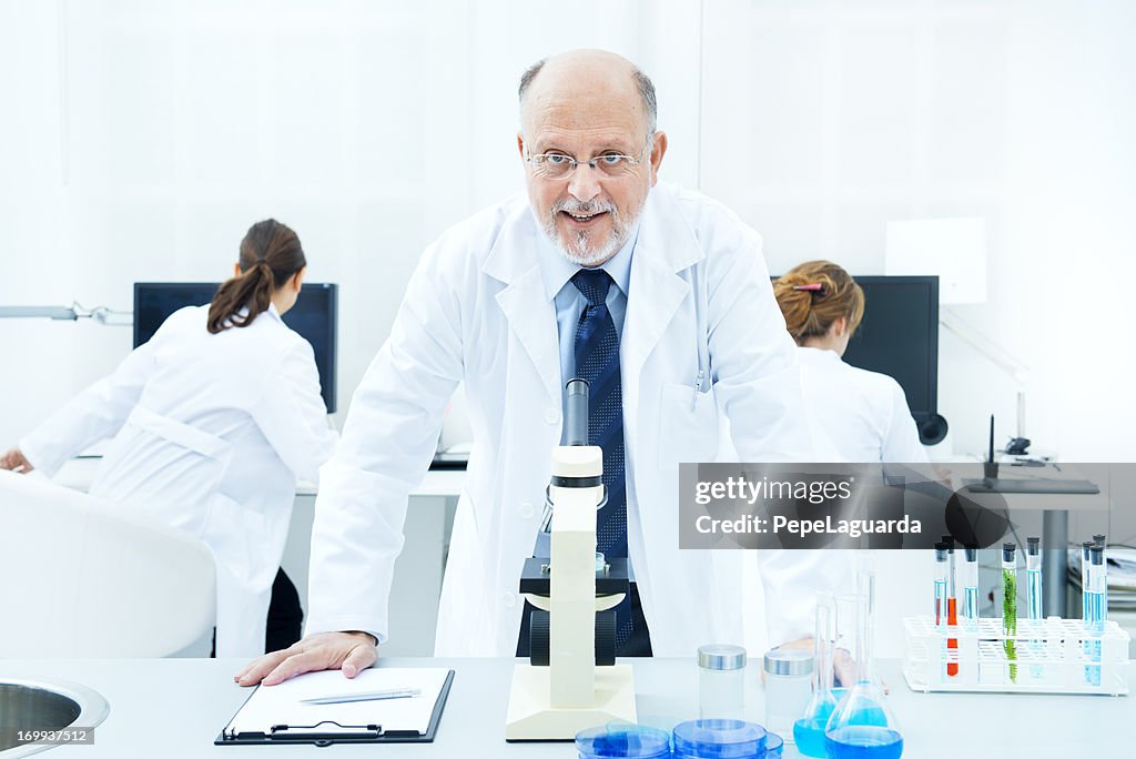 Scientists working in analysis laboratory