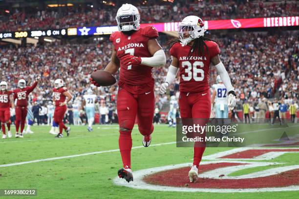 Kyzir White of the Arizona Cardinals celebrates an interception with Andre Chachere during the fourth quarter of a game against the Dallas Cowboys at...