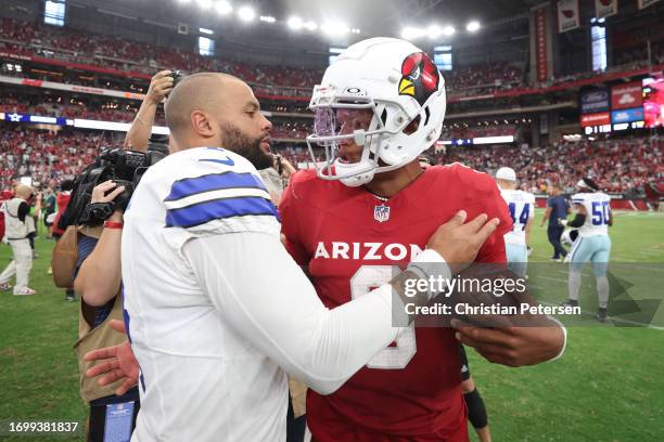 Dak Prescott of the Dallas Cowboys embraces Joshua Dobbs of the Arizona Cardinals following the game at State Farm Stadium on September 24, 2023 in...