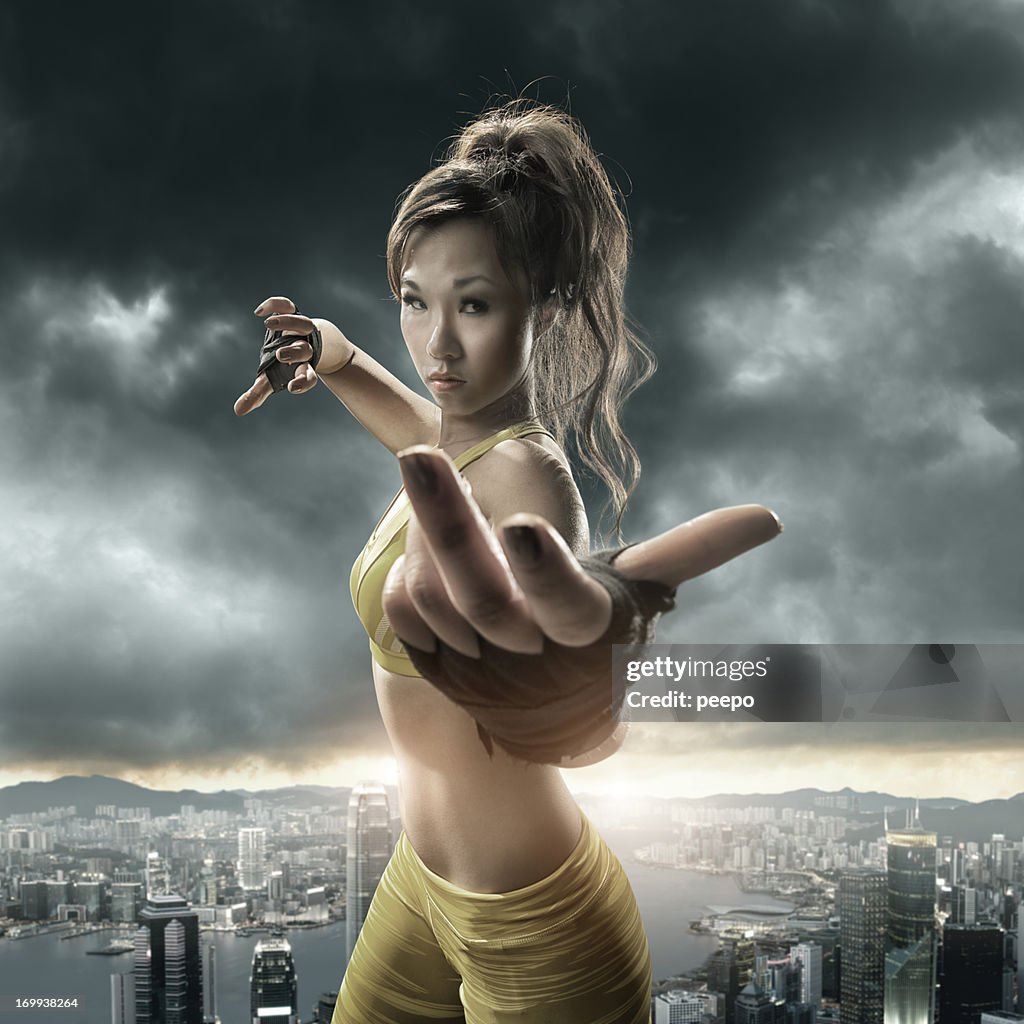 Girl Practising Martial Arts above Cityscape